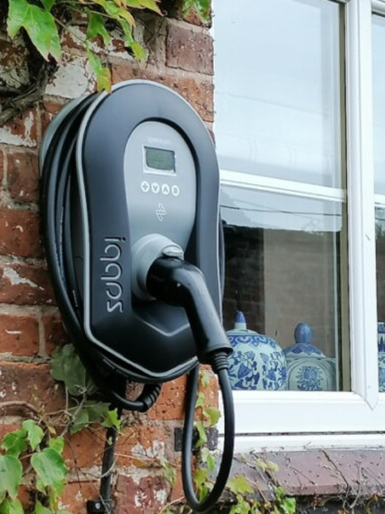 Electric vehicle charger installed on a residential property
