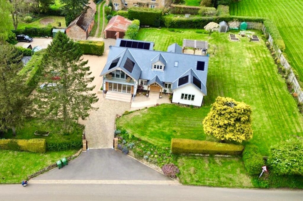 A picturesque detached house in Warwickshire with a multi-roof solar panel installation