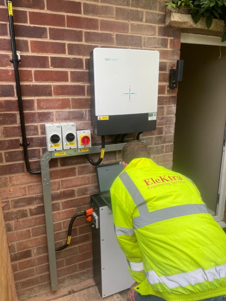 En Elektra Smart Energy engineer installing a GivEnergy solar battery at a residential property