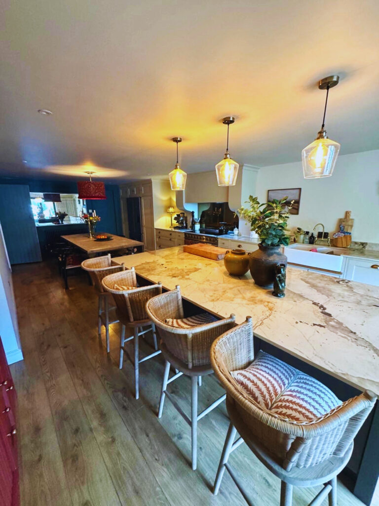 Kitchen and dining room with intricate lighting