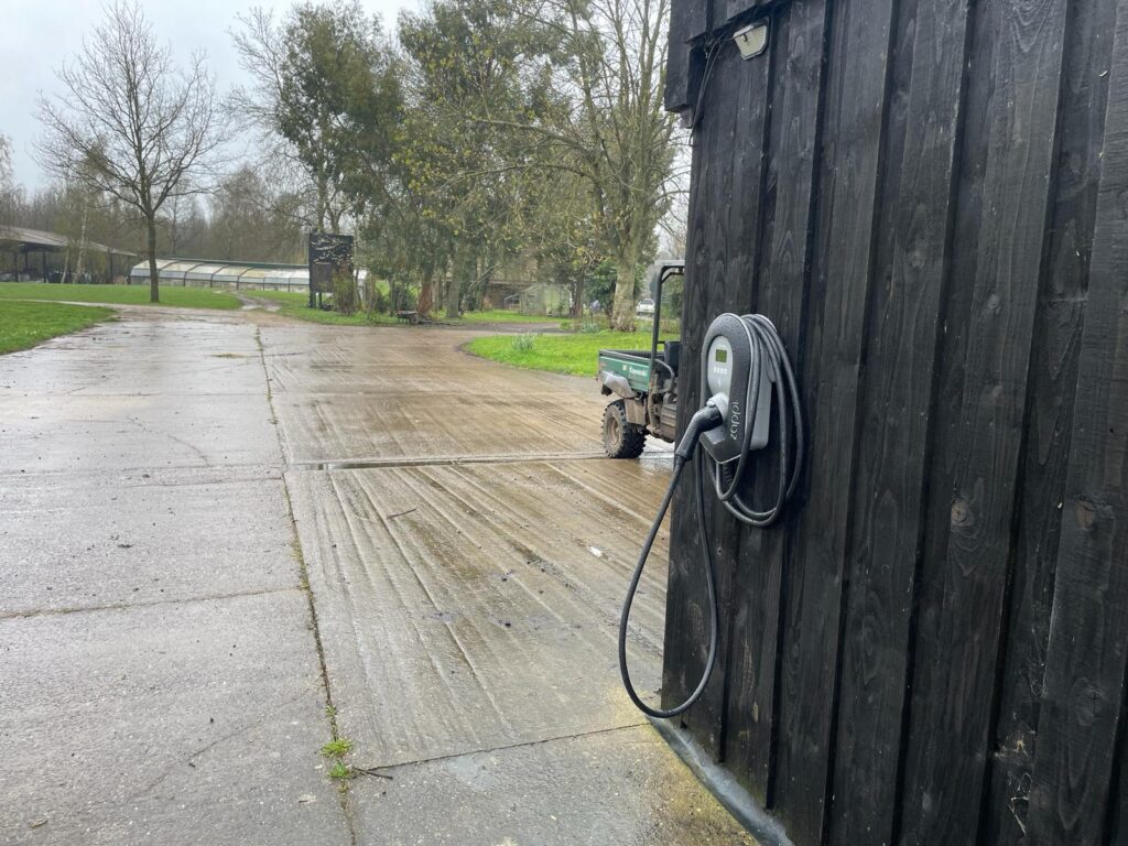 Side view of a Zappi EV charger installed in a Warwickshire Farm
