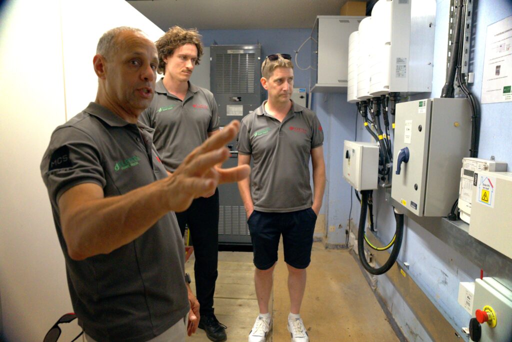 Uri Ben-Tovim explaining the inner workings of an intricate solar battery storage system