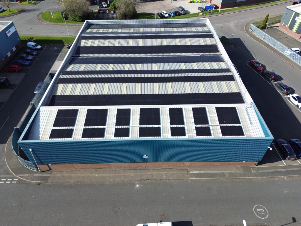 A warehouse with a large-scale commercial solar panel installation